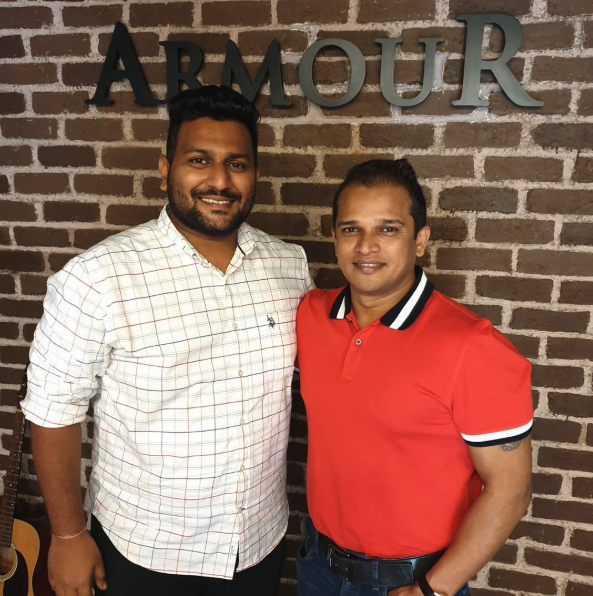 Mahesh Mulik with a client at the Armour studio